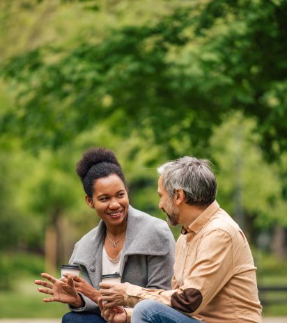 Husband and African wife, talking to each other in the nature.